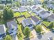 The home is located in a quiet neighborhood with well-manicured lawns and tree-lined streets at 6945 Agava Ln, Charlotte, NC 28215