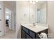 Bathroom featuring a dark vanity with a white countertop and a sink at 6945 Agava Ln, Charlotte, NC 28215