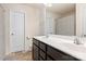 Bathroom featuring a double sink vanity with modern fixtures and tile flooring at 6945 Agava Ln, Charlotte, NC 28215