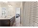 Bathroom featuring a double sink vanity, bright lighting, and a shower at 6945 Agava Ln, Charlotte, NC 28215