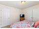 Standard bedroom showcasing a soft carpet, simple closet, and a comfy bed at 6945 Agava Ln, Charlotte, NC 28215