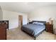 Bedroom showcases plush carpet, a bed, and neutral tones at 6945 Agava Ln, Charlotte, NC 28215
