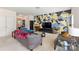 Open-concept living room showcasing modern decor, plenty of seating, and neutral walls at 6945 Agava Ln, Charlotte, NC 28215