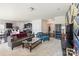 Open-plan living area with kitchen views, modern decor, and multiple seating options at 6945 Agava Ln, Charlotte, NC 28215