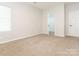 Bedroom with carpet flooring, white trim, and a closet at 703 Bradberry Ln, Indian Trail, NC 28079