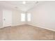 Bright bedroom with neutral walls, carpet flooring and windows at 703 Bradberry Ln, Indian Trail, NC 28079