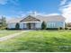Community clubhouse with stone accents, well-maintained lawn, and welcoming entrance at 703 Bradberry Ln, Indian Trail, NC 28079