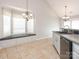 Bright kitchen featuring a breakfast nook with a bay window and a built-in window seat at 703 Bradberry Ln, Indian Trail, NC 28079