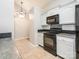 Modern kitchen showcasing updated appliances, stylish backsplash, and ample cabinet space at 703 Bradberry Ln, Indian Trail, NC 28079