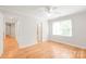 Comfortable bedroom offers ample space, neutral tones, and abundant natural light streaming in at 7301 Leharne Dr, Charlotte, NC 28270
