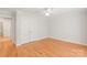 Spacious bedroom featuring hardwood floors and a large closet with bi-fold doors at 7301 Leharne Dr, Charlotte, NC 28270