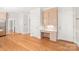 Bright entryway with hardwood floors and a convenient built-in desk area offers both functionality and style at 7301 Leharne Dr, Charlotte, NC 28270