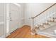 Open foyer with staircase, hardwood floors, entry door, and closet at 7301 Leharne Dr, Charlotte, NC 28270