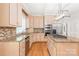 Well-equipped kitchen featuring granite countertops, stainless appliances, and wood floors at 7301 Leharne Dr, Charlotte, NC 28270