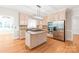 Spacious kitchen with stainless steel appliances, center island, and tiled backsplash at 7301 Leharne Dr, Charlotte, NC 28270