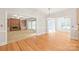 Open view of dining room and living room with fireplace and built-in shelves at 7301 Leharne Dr, Charlotte, NC 28270