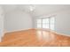 Spacious main bedroom featuring hardwood floors, vaulted ceilings, and bay windows at 7301 Leharne Dr, Charlotte, NC 28270