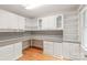 Home office space featuring custom cabinetry, built-in desk, and plenty of natural light at 7301 Leharne Dr, Charlotte, NC 28270
