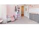 Pink bedroom featuring a canopy bed, and plenty of storage for toys at 810 Maplewood Ave, Kannapolis, NC 28081