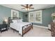Cozy bedroom with natural light, carpet flooring, and a ceiling fan at 810 Maplewood Ave, Kannapolis, NC 28081