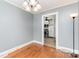 Dining room features wood floors, neutral paint, and flows into the kitchen at 810 Maplewood Ave, Kannapolis, NC 28081