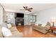 Inviting living room featuring a fireplace, ceiling fan, and hardwood floors at 810 Maplewood Ave, Kannapolis, NC 28081