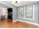 Bright living area with hardwood floors, fireplace, and double windows at 810 Maplewood Ave, Kannapolis, NC 28081