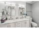 Stylish bathroom with dual sinks, marble countertops, and modern fixtures at 8618 Sam Dee Rd, Charlotte, NC 28215