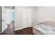 Bedroom featuring a daybed, hardwood floors, closet, and a view of the hallway at 8618 Sam Dee Rd, Charlotte, NC 28215