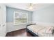 Cozy bedroom with wood floors and plenty of natural light at 8618 Sam Dee Rd, Charlotte, NC 28215