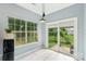 Cozy breakfast nook with large windows and sliding door leading to the backyard at 8618 Sam Dee Rd, Charlotte, NC 28215