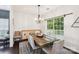 Cozy dining room with a modern chandelier, a large window, and hardwood floors at 8618 Sam Dee Rd, Charlotte, NC 28215