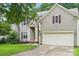 Two-story home with light brown siding, red shutters, attached garage, and covered front entrance with white pillars at 8618 Sam Dee Rd, Charlotte, NC 28215