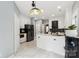 Open kitchen featuring white cabinets, stainless steel appliances, and a center island at 8618 Sam Dee Rd, Charlotte, NC 28215