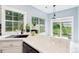 Beautiful kitchen with ample counter space, modern appliances, and a view to the backyard at 8618 Sam Dee Rd, Charlotte, NC 28215