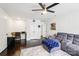 Comfortable living room with gray sofa, ceiling fan and built-in office area with dark hardwood floors at 8618 Sam Dee Rd, Charlotte, NC 28215