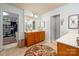 A clean bathroom shows a double vanity, walk-in closet, and separate water closet at 8909 Savannah Rd, Harrisburg, NC 28075