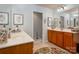 Bathroom showcasing -and- vanities and a separate water closet for added privacy at 8909 Savannah Rd, Harrisburg, NC 28075