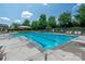 Stunning community pool with plenty of seating and shade, providing a perfect summer retreat for residents at 8909 Savannah Rd, Harrisburg, NC 28075