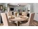 Dining room featuring a round table with four chairs, and direct access to the living room at 8909 Savannah Rd, Harrisburg, NC 28075