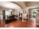 Elegant dining room with hardwood floors, a chandelier, and an open layout at 8909 Savannah Rd, Harrisburg, NC 28075