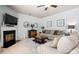 Comfortable living room with a fireplace, decorative mirrors, and a plush sofa arrangement at 8909 Savannah Rd, Harrisburg, NC 28075