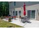 Relaxing patio with outdoor dining and seating, ideal for entertaining or enjoying quiet evenings at 8909 Savannah Rd, Harrisburg, NC 28075