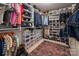 A spacious walk-in closet features custom shelves and storage for shoes, clothes, and accessories at 8909 Savannah Rd, Harrisburg, NC 28075