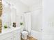 Bathroom with single vanity, tub, shower and decorative towels at 9030 Gander Dr, Charlotte, NC 28277