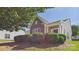 Lovely single-story home with stone and siding exterior and charming front porch, enhanced by neatly trimmed landscaping at 9030 Gander Dr, Charlotte, NC 28277