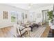 Sun-drenched living room featuring a neutral color palette and an open layout with laminate flooring at 9030 Gander Dr, Charlotte, NC 28277
