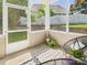 Cozy porch with serene views of the grassy backyard, designed for peaceful relaxation and outdoor enjoyment at 9030 Gander Dr, Charlotte, NC 28277