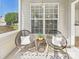 Bright, cozy porch with comfortable seating, perfect for enjoying outdoor relaxation and a sunny day at 9030 Gander Dr, Charlotte, NC 28277