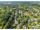 Beautiful aerial of neighborhood featuring mature trees and a pond at 9038 Sandpiper Dr, Charlotte, NC 28277